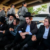 Ultra-Orthodox men clash with police during a protest against military enlistment, Bnei Brak, August 8, 2026. (Avshalom Sassoni/Flash90)
