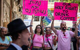 Secular activists hold up placards as they stage a counter-protest against Haredi men at Cafe Basimta in Jerusalem, on August 15, 2026. The Hebrew sign reads "We will die rather than drink instant," a play on a slogan used by Haredi men against the IDF draft. (Oren Ben Hakoon/Flash90)