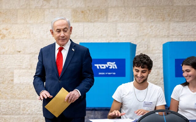 Prime Minister Benjamin Netanyahu casts his vote at a polling station in Jerusalem on August 17, 2026, as Likud members vote in primary elections to help determine the party’s Knesset slate. (Chaim Goldberg/Flash90)