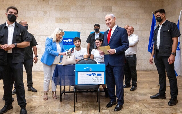 Prime Minister Benjamin Netanyahu and his wife Sara vote in Jerusalem in the Likud primary, August 17, 2026, as Likud members help determine the party’s Knesset slate ahead of Israel's October 27 general elections. (Chaim Goldberg/Flash90)