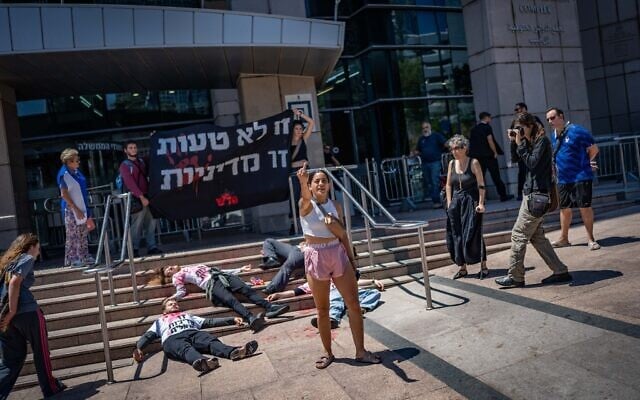 Activists protest against Israeli abuse of Palestinians, in central Tel Aviv, August 19, 2026. (Erik Marmor/Flash90)