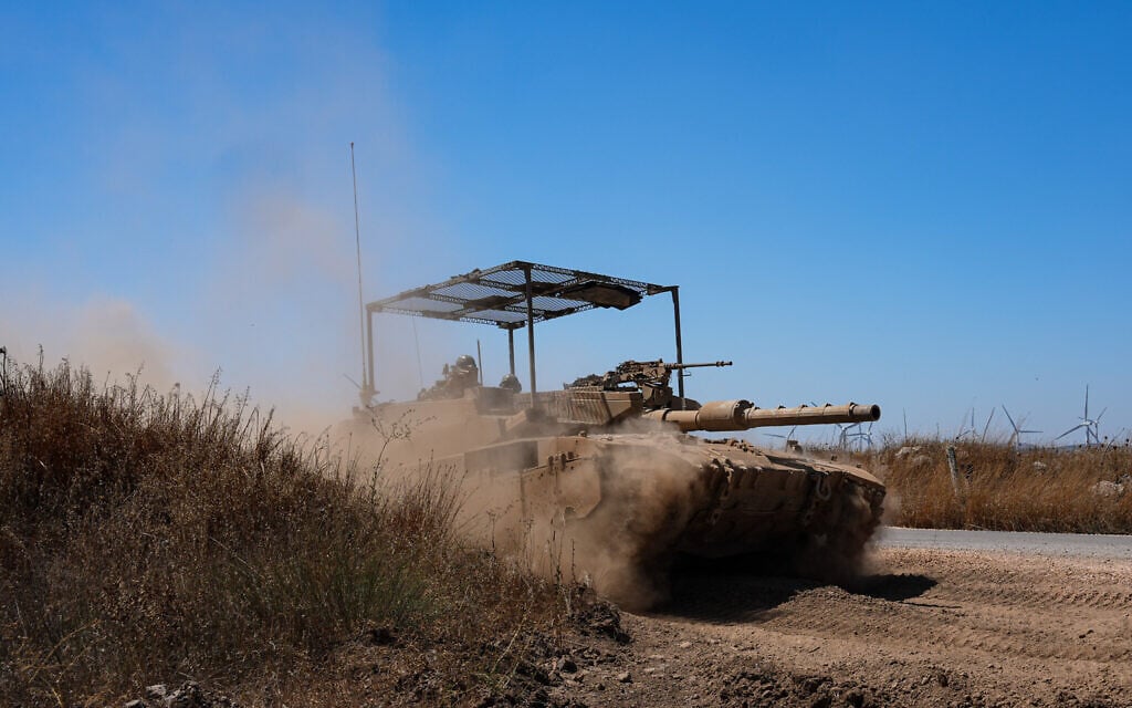 An IDF tank patrols along the border with Syria in the Golan Heights, August 20, 2026. (Ayal Margolin/Flash90) An IDF tank patrols along the border with Syria in the Golan Heights, August 20, 2026. (Ayal Margolin/Flash90)
