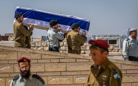 IDF soldiers carry the coffin of Sgt. First Class Yehuda Katz, whose body was returned from Lebanon this week, 44 years after he went missing in battle, at the Mount of Olives cemetery in Jerusalem, August 21, 2026. (Chaim Goldberg/Flash90)