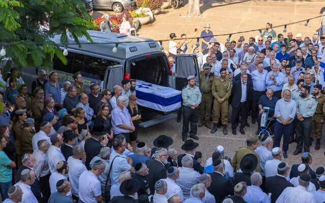 The funeral procession of Sgt. First Class Yehuda Katz, whose body was returned from Lebanon this week, 44 years after he went missing in battle, departs from the Kerem B'Yavneh yeshiva, where he studied before his military service, in southern Israel, on August 21, 2026. (Liron Moldovan/Flash90)