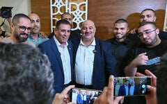 Ra’am party chairman Mansour Abbas (center right) holds a joint press conference with former Yesh Atid MK Yoav Segalovitz (center left), who will run on the Ra'am slate in October's election, in Nazareth. August 31, 2026. (Michael Giladi/FLASH90)