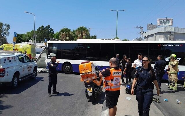 Medics and police officers at the scene of a fatal crash involving multiple buses in Ashkelon, August 4, 2026. (United Hatzalah)