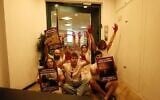 Protesters from the Arab-Jewish left-wing movement Standing Together block the entrance to the Religious Zionism party's office in Shoham, August 5, 2026. (Standing Together on X)