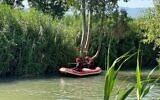 Rescuers search for Elhanan Karni, 12, after he fell into the Jordan River in northern Israel, August 9, 2026. He was later found and pronounced dead at the scene. (Israel Fire and Rescue Service)