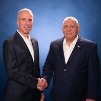 Former Yesh Atid MK Elazar Stern (left) shakes hands with Yashar party leader Gadi Eisenkot, in an image published on August 24, 2026. (Gadi Eisenkot/X)