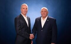 Former Yesh Atid MK Elazar Stern (left) shakes hands with Yashar party leader Gadi Eisenkot, in an image published on August 24, 2026. (Gadi Eisenkot/X)