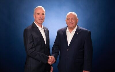 Former Yesh Atid MK Elazar Stern (left) shakes hands with Yashar party leader Gadi Eisenkot, in an image published on August 24, 2026. (Gadi Eisenkot/X)