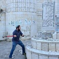 Far-right lawmaker Zvi Sukkot smashes a Palestinian monument to 'martyrs' in the West Bank village of Madama, August 25, 2026 (MK Zvi Sukkot's office)