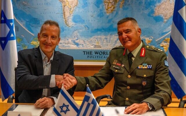 Defense Ministry Director General Amir Baram (left) and his Greek counterpart, Ioannis Bouras,  sign a sale of Israeli systems to Greece, August 31, 2026. (Defense Ministry)