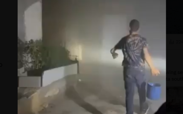 Residents in Khirbet a-Tuba in the West Bank's South Hebron Hills attempt to douse flames after extremist settlers allegedly set fire to several homes and attacked people, August 6, 2026 (video screenshot; used in accordance with Clause 27a of the Copyright Law)