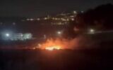 Footage of a fire reportedly sparked by settlers on the outskirts of the central West Bank Palestinian village of Turmus Ayya on August 17, 2026. (Screen capture/X)