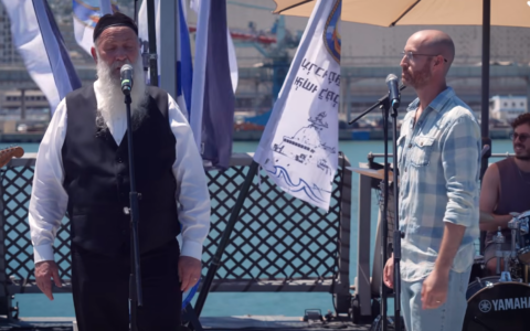 Shuli Rand, left, and rapper Jimbo J duet their hit songs ahead of Rosh Hashanah, in August 2026. (YouTube screenshot)
