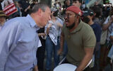 Brad Lander argues with anti-Zionist protesters in New York City, August 29, 2026. (Screenshot/FreedomNews TV)