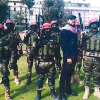 Mahmoud Amin Ya’qub Al-Muhtadi, in black, with a group of Democratic Front for the Liberation of Palestine trainees, in 2022. (US Western District of Louisiana court)