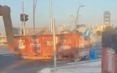 Dumpsters are placed on a road at the entrance to a neighborhood that has a significant secular population, in the ultra-Orthodox city of Bnei Brak, ahead of Shabbat on August 29, 2026. (Screenshot: X/Tuvya Yagelnik)