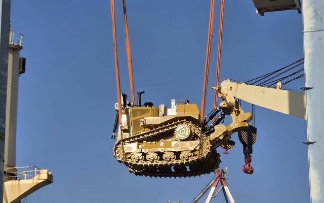 A D9 bulldozer is unloaded from a ship at Haifa Port, in a photo published by the Defense Ministry on August 13, 2026. (Defense Ministry)