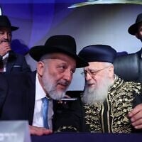 Shas chairman Aryeh Deri with Rabbi Yitzhak Yosef, the spiritual leader of Shas, on the stage at the party's election campaign opening event in Holon, August 21, 2026. (Yaakov Cohen)