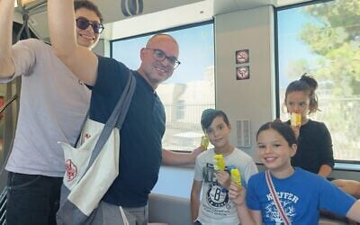 Daniel Ginsburg and his kids ride the new L3 light rail route, August 21, 2026 (Zev Stub/Times of Israel) Daniel Ginsburg and his kids ride the new L3 light rail route, August 21, 2026 (Zev Stub/Times of Israel)