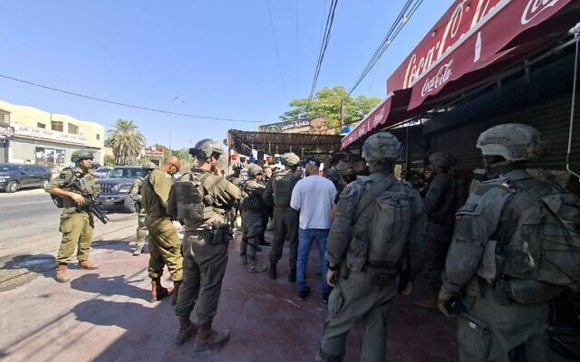 Troops at the scene of a stabbing attack in al-Auja in the West Bank on August 23, 2026. (IDF)