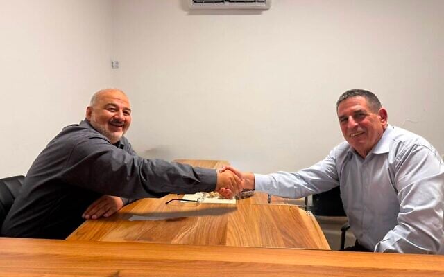 Ra'am chairman Mansour Abbas (left) and former Yesh Atid MK Yoav Segalovitz in a handout photo released by the party on August 26, 2026. (Courtesy)
