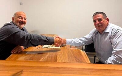 Ra'am chairman Mansour Abbas (left) and former Yesh Atid MK Yoav Segalovitz in a handout photo released by the party on August 26, 2026. (Courtesy)