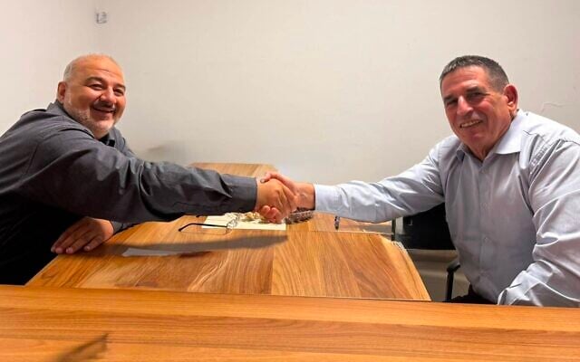 Ra'am chairman Mansour Abbas (left) and former Yesh Atid MK Yoav Segalovitz in a handout photo released by the party on August 26, 2026. (Courtesy)