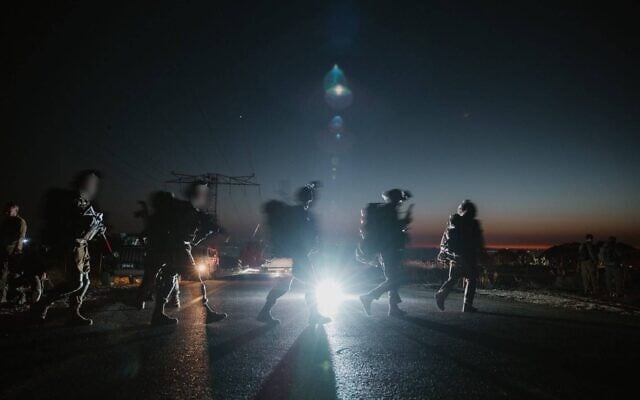 Troops of the Hasmonean Brigade's Shimon Reserve Battalion conduct a drill in the Golan Heights, in a handout photo published by the military on August 11, 2026. (Israel Defense Forces)