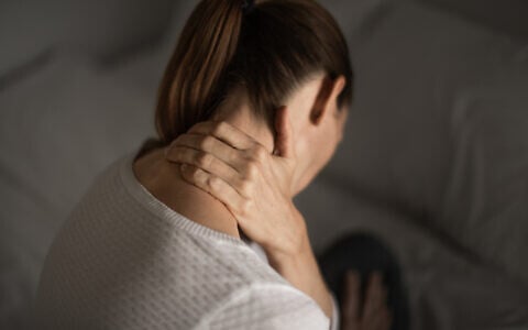 Illustrative: A woman having shoulder and neck pain (kieferpix; iStock via Getty Images)