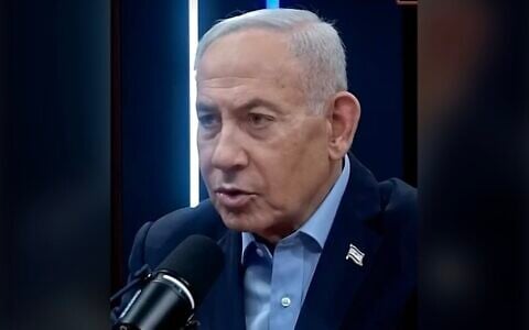 Prime Minister Benjamin Netanyahu discusses an Israeli airstrike in Syria, in a podcast interview, August 19, 2026. (Screenshot via X)