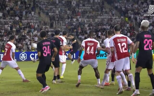 Sabah's Tellur Mutallimov (at rear, center) shoots home in the final seconds of stoppage time to force extra time in his team's home match against Hapoel Beersheba, on August 25, 2026. The Azerbaijani team eventually won the game by 5-2, for an aggregate 6-4 win, qualifiying at Hapoel's expense for the European Champions League. (Israel Sports Channel 5 screenshot)