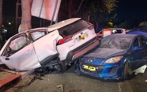 Cars are seen at the a-Tur Junction in Jerusalem after a suspected car thief got into an accident during a police chase, in a picture published by police on August 26, 2026. (Israel Police)