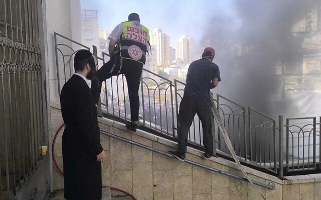 First responders work the scene of a fire that broke out at the Nadvorna Hassidic center in Bnei Brak on August 26, 2026. (Fire and Rescue Service)