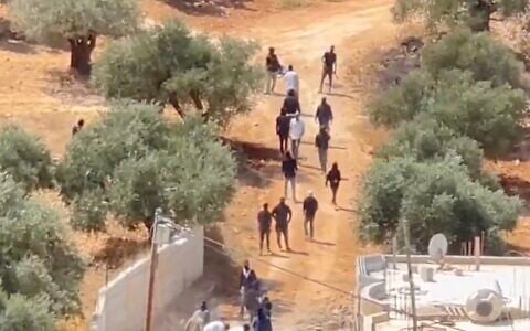 Settlers arriving on the outskirts of Qusra in the West Bank on August 29, 2026. (Screen grab X via Quds News)
