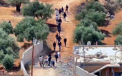 Settlers arriving on the outskirts of Qusra in the West Bank on August 29, 2026. (Screen grab/Quds News via X)