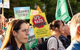 A banner reading 'Stop AfD Nazis' is seen during a demonstration against the rise of the far-right Alternative for Germany (AfD) party in front of the Brandenburg Gate in Berlin on September 7, 2026. (Emmanuele Contini/NurPhoto via Getty Images via JTA)