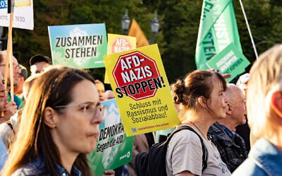 A banner reading 'Stop AfD Nazis' is seen during a demonstration against the rise of the far-right Alternative for Germany (AfD) party in front of the Brandenburg Gate in Berlin on September 7, 2026. (Emmanuele Contini/NurPhoto via Getty Images via JTA) A banner reading 'Stop AfD Nazis' is seen during a demonstration against the rise of the far-right Alternative for Germany (AfD) party in front of the Brandenburg Gate in Berlin on September 7, 2026. (Emmanuele Contini/NurPhoto via Getty Images via JTA)