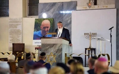 Heaton Park Synagogue's Rabbi Daniel Walker speaks at a memorial service for victims of the 2025 Yom Kippur terror attack, August 31, 2026 (Courtesy Jewish Representative Council of Greater Manchester and Region)