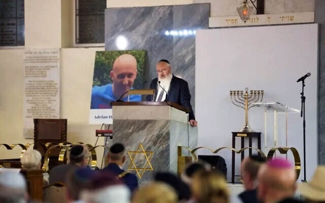 Heaton Park Synagogue's Rabbi Daniel Walker speaks at a memorial service for victims of the 2025 Yom Kippur terror attack, August 31, 2026 (Courtesy Jewish Representative Council of Greater Manchester and Region)