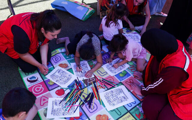 Displaced children participate in a colouring activity organised by the NGO Save the Children at a school turned into a shelter for displaced families in Tyre, southern Lebanon, August 27, 2026. (Mohamad Azakir/Reuters) Displaced children participate in a colouring activity organised by the NGO Save the Children at a school turned into a shelter for displaced families in Tyre, southern Lebanon, August 27, 2026. (Mohamad Azakir/Reuters)