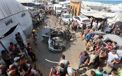 Palestinian firefighters extinguish a fire on a vehicle hit by an Israeli airstrike in Khan Younis, in the southern Gaza Strip, September 23, 2026. (Ramadan Abed/Reuters) Palestinian firefighters extinguish a fire on a vehicle hit by an Israeli airstrike in Khan Younis, in the southern Gaza Strip, September 23, 2026. (Ramadan Abed/Reuters)