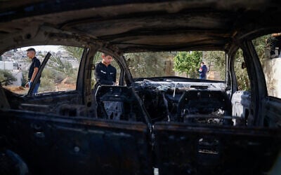Palestinian men stand near a vehicle damaged in what they say was an Israeli settler attack, in Al-Mughayyir, near Ramallah, on September 29, 2026. (Mohamad Torokman/Reuters) Palestinian men stand near a vehicle damaged in what they say was an Israeli settler attack, in Al-Mughayyir, near Ramallah, on September 29, 2026. (Mohamad Torokman/Reuters)