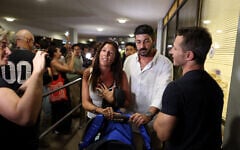 Passengers who were on a flydubai aircraft bound for Israel from the United Arab Emirates that suffered an emergency mid-air, with the co-pilot subdued after stabbing the captain in an alleged attempt to crash the plane, arrive back home at Ben Gurion Airport, September 30, 2026 
(Ammar Awad/Reuters)