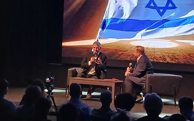 Democrats party chair Yair Golan, left, speaks in Tel Aviv on September 6, 2026. (Noam Lehmann/The Times of Israel)