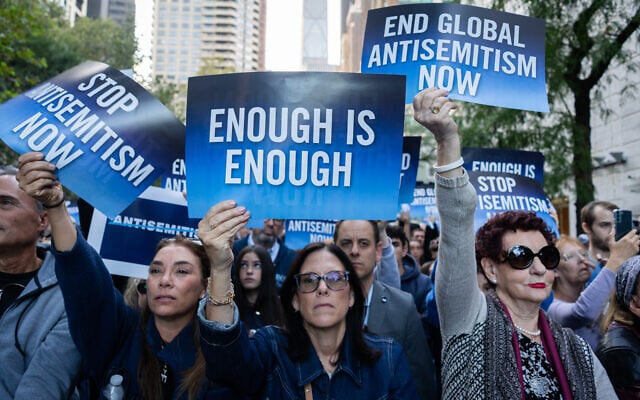 Protesters demand world leaders take action against antisemitism outside the United Nations in New York City, September 23, 2026. (Luke Tress/Times of Israel)