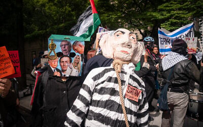 A protester with a bag on their head next to an effigy of Prime Minister Benjamin Netanyahu in a noose, in New York City, September 24, 2026. (Luke Tress/Times of Israel) A protester with a bag on their head next to an effigy of Prime Minister Benjamin Netanyahu in a noose, in New York City, September 24, 2026. (Luke Tress/Times of Israel)