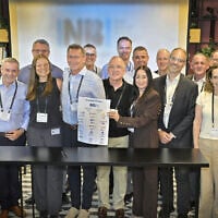 Dr. Anat Cohen-Dayag (front fourth from the right) and Sam Moed (front fourth from the left) launch Israel National Biotech Innovation Center (INBI) with representatives of the 15 top universities, medical centers and health organizations in Israel, Sept. 6, 2026. (Courtesy of Yossi Zwecker)